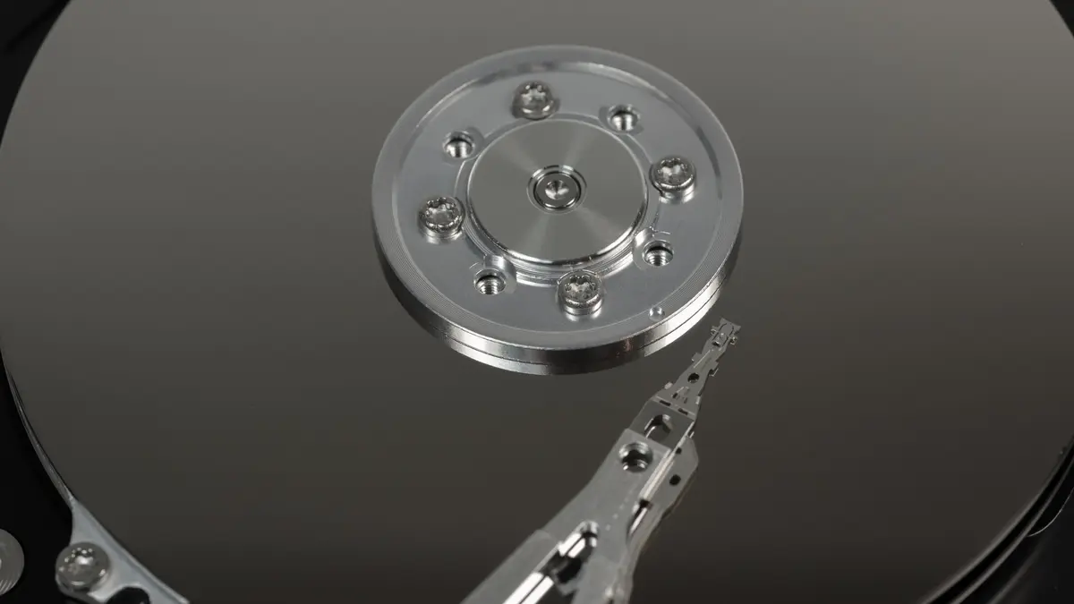 Macro shot of a hard drive platter and its read arm